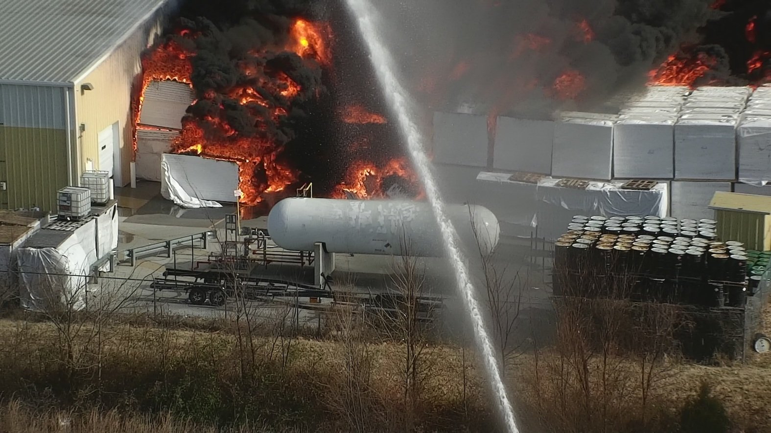 Drone close-up on a volatile industrial fire