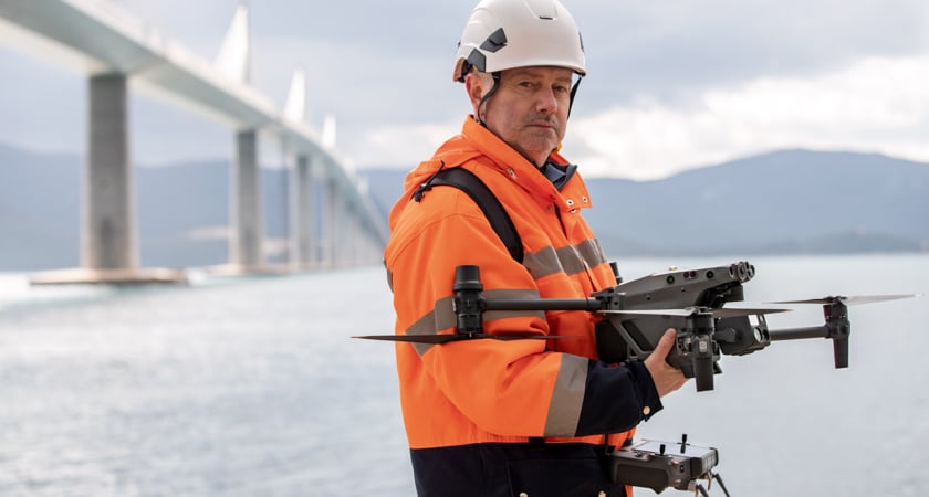 A man holding a drone