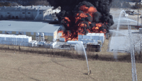 Firefighting drones fly over an industrial fire in Bentonville, Arkansas