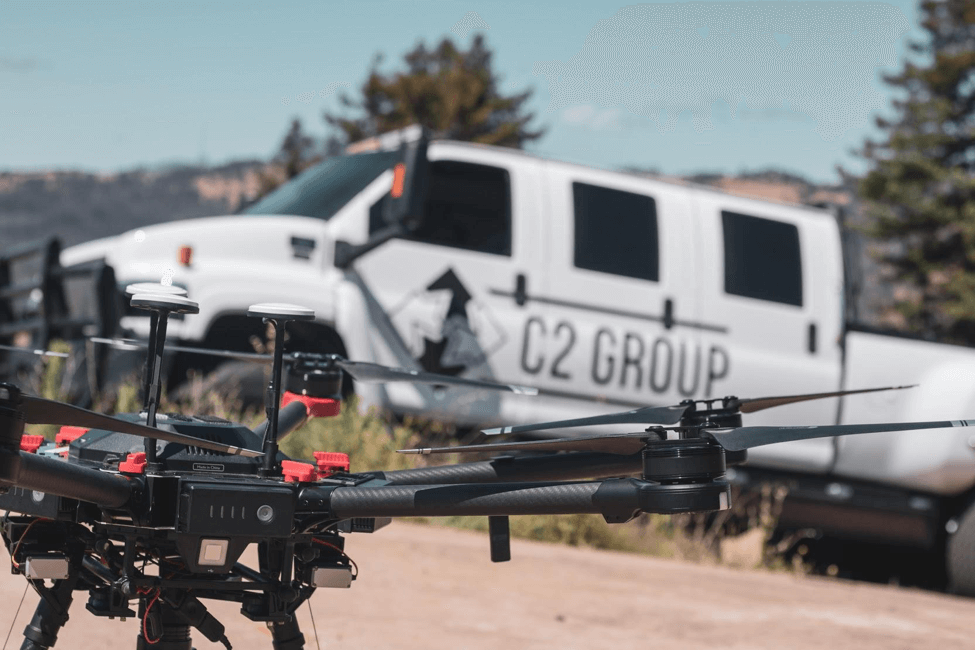 One of C2’s DJI M600s in the field, with a C2 vehicle in the background