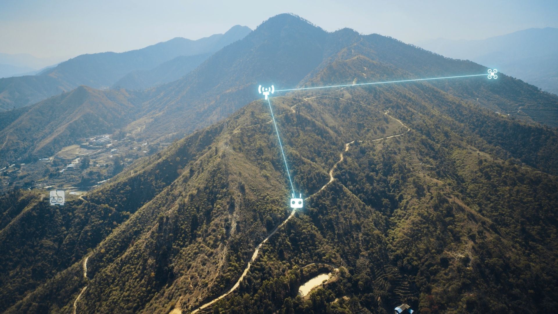 DJI illustration of an O4 Ground Station on high terrain relaying between a controller and aircraft